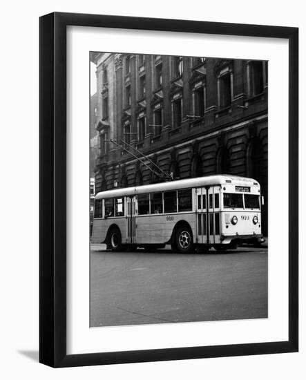 1930s-1940s Public Transportation Trackless Trolley Electric Bus About to Round Street Corner-null-Framed Photographic Print