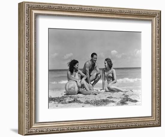 1930s 1940s TWO WOMEN ONE MAN IN BATHING SUITS SITTING ON BEACH-Panoramic Images-Framed Photographic Print