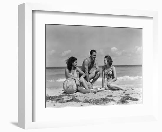 1930s 1940s TWO WOMEN ONE MAN IN BATHING SUITS SITTING ON BEACH-Panoramic Images-Framed Photographic Print