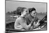 1930s MAN DRIVING CONVERTIBLE AUTOMOBILE WHILE GIRLFRIEND LIGHTS HIS CIGARETTE-H. Armstrong Roberts-Mounted Photographic Print