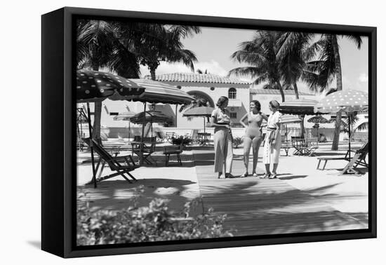 1930s THREE YOUNG WOMEN STANDING TALKING IN CABANA AREA OF CLUB NAUTILUS HOTEL MIAMI BEACH FLORI...-H. Armstrong Roberts-Framed Premier Image Canvas