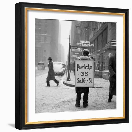 1930s Winter Street Scene of Man Wearing Pawnbroker Sandwich Board-null-Framed Photographic Print