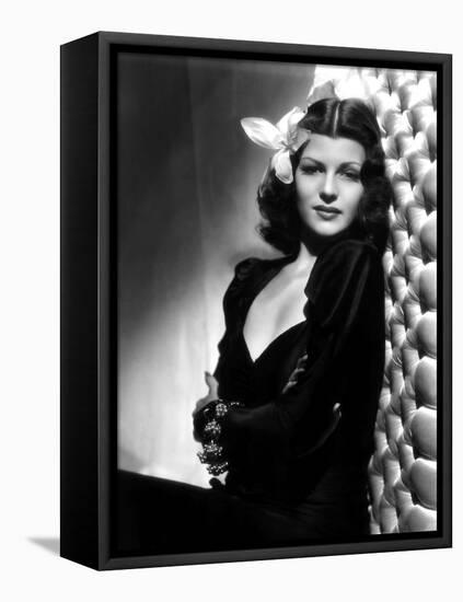 , 1940: American actress Rita Hayworth (1918 - 1987) with an exotic flower in her hair (Photo by A.-null-Framed Stretched Canvas