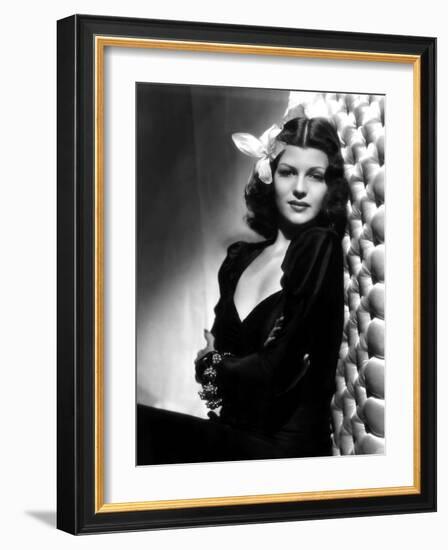 , 1940: American actress Rita Hayworth (1918 - 1987) with an exotic flower in her hair (Photo by A.-null-Framed Photo