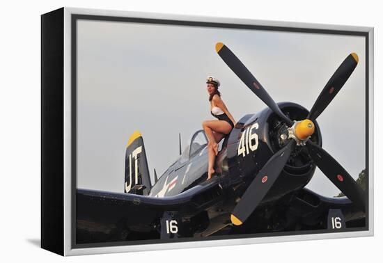 1940's Style Navy Pin-Up Girl Sitting on a Vintage Corsair Fighter Plane-null-Framed Premier Image Canvas