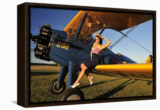 1940's Style Pin-Up Girl Sitting on the Wing of a Stearman Biplane-null-Framed Premier Image Canvas