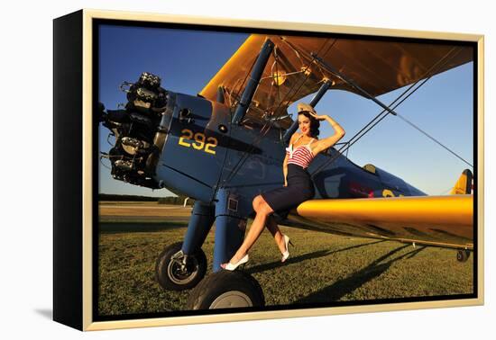 1940's Style Pin-Up Girl Sitting on the Wing of a Stearman Biplane-null-Framed Premier Image Canvas