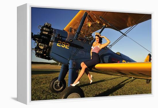 1940's Style Pin-Up Girl Sitting on the Wing of a Stearman Biplane-null-Framed Premier Image Canvas