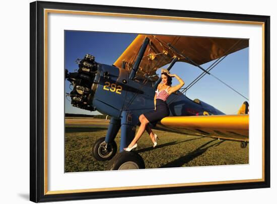 1940's Style Pin-Up Girl Sitting on the Wing of a Stearman Biplane-null-Framed Premium Photographic Print