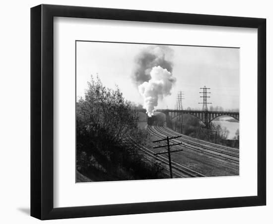 1940s Aerial of Train Traveling Along River under Bridge Billowing Smoke Near Columbus, Ohio-null-Framed Photographic Print