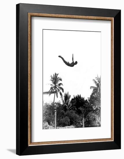 1940s MAN POISED MIDAIR ARMS OUT JUMPING FROM DIVING BOARD INTO POOL-H. Armstrong Roberts-Framed Photographic Print