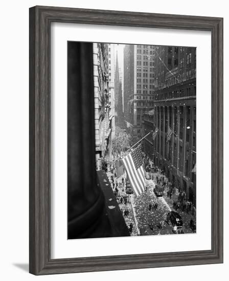 1945 Aerial View of VE Day Celebration on Wall Street NYC with Flags and Confetti Flying-null-Framed Photographic Print