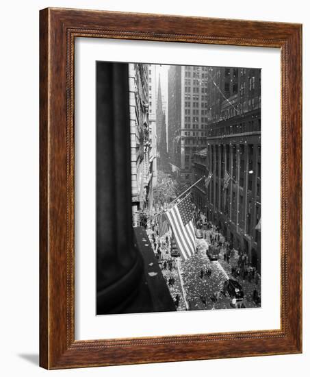 1945 Aerial View of VE Day Celebration on Wall Street NYC with Flags and Confetti Flying-null-Framed Photographic Print