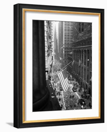 1945 Aerial View of VE Day Celebration on Wall Street NYC with Flags and Confetti Flying-null-Framed Photographic Print