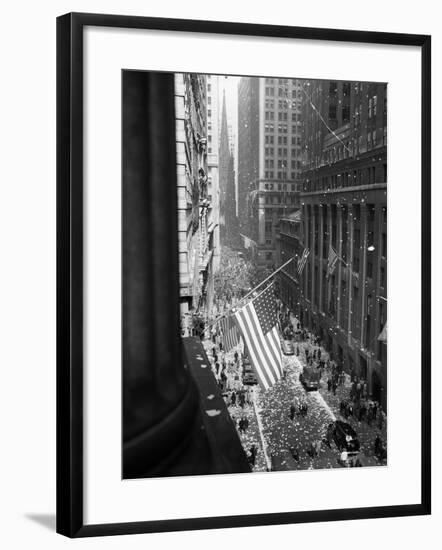 1945 Aerial View of VE Day Celebration on Wall Street NYC with Flags and Confetti Flying-null-Framed Photographic Print