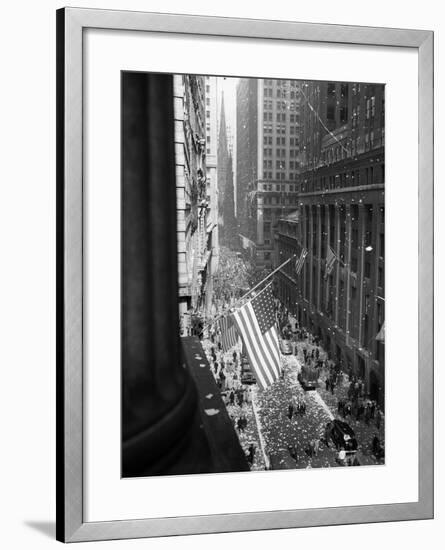 1945 Aerial View of VE Day Celebration on Wall Street NYC with Flags and Confetti Flying-null-Framed Photographic Print