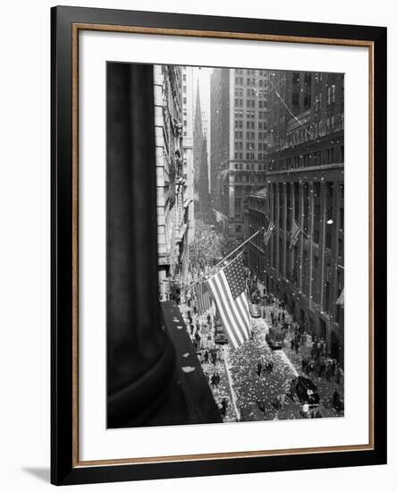 1945 Aerial View of VE Day Celebration on Wall Street NYC with Flags and Confetti Flying-null-Framed Photographic Print