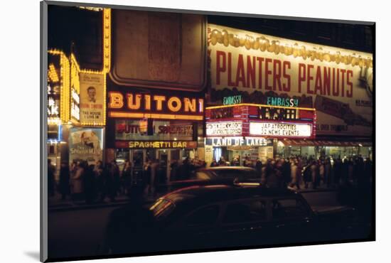 1945: Embassy Theater Showing Newsreel Format Films at Night, Times Square, New York, NY-Andreas Feininger-Mounted Photographic Print