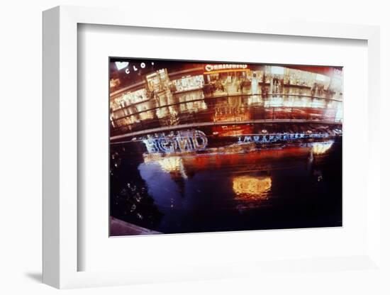 1945: New York Street in Times Square at Night. Neon Signs and Billboards Reflect on Rain-Andreas Feininger-Framed Photographic Print