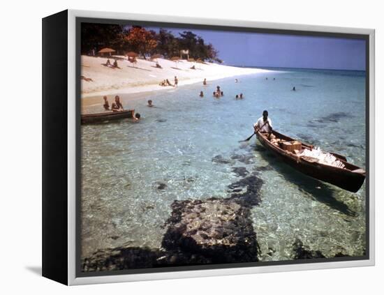 1946: Sam Cunningham Sells Sea Shells to Tourist Along the Seashore in Montego Bay, Jamaica-Eliot Elisofon-Framed Premier Image Canvas