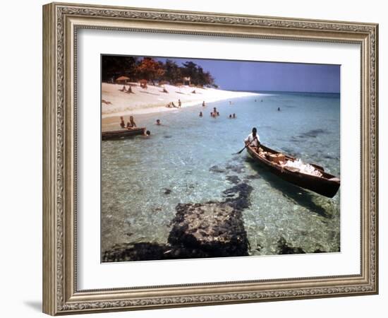 1946: Sam Cunningham Sells Sea Shells to Tourist Along the Seashore in Montego Bay, Jamaica-Eliot Elisofon-Framed Photographic Print