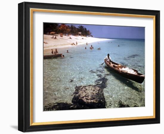 1946: Sam Cunningham Sells Sea Shells to Tourist Along the Seashore in Montego Bay, Jamaica-Eliot Elisofon-Framed Photographic Print