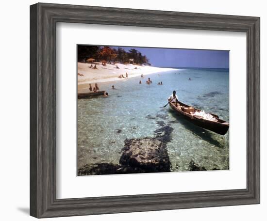 1946: Sam Cunningham Sells Sea Shells to Tourist Along the Seashore in Montego Bay, Jamaica-Eliot Elisofon-Framed Premium Photographic Print