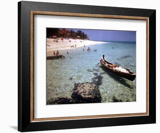 1946: Sam Cunningham Sells Sea Shells to Tourist Along the Seashore in Montego Bay, Jamaica-Eliot Elisofon-Framed Premium Photographic Print