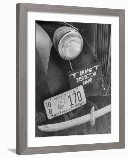 1949 Idaho License Plate Featuring a Buttered Baked Potato on a Cattle Brand Inspector's Car-null-Framed Photographic Print