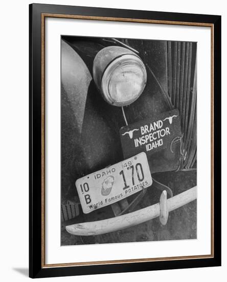 1949 Idaho License Plate Featuring a Buttered Baked Potato on a Cattle Brand Inspector's Car-null-Framed Photographic Print
