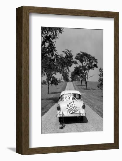 1950s BACK OF WHITE FORD SEDAN DRIVING OFF WITH JUST MARRIED SIGN ON TRUNK-H. Armstrong Roberts-Framed Photographic Print