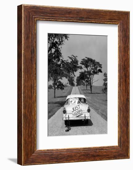 1950s BACK OF WHITE FORD SEDAN DRIVING OFF WITH JUST MARRIED SIGN ON TRUNK-H. Armstrong Roberts-Framed Photographic Print