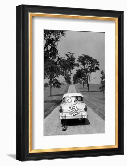 1950s BACK OF WHITE FORD SEDAN DRIVING OFF WITH JUST MARRIED SIGN ON TRUNK-H. Armstrong Roberts-Framed Photographic Print