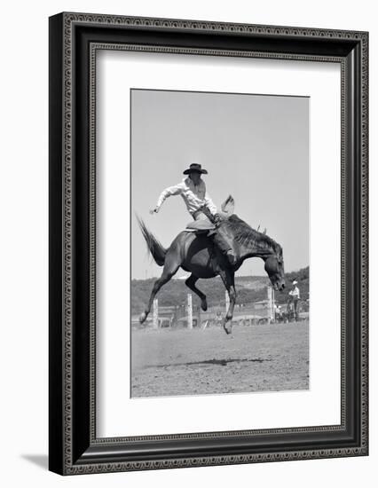 1950s COWBOY RIDING A HORSE BAREBACK ON A WESTERN RANCH USA-Pound-Framed Photographic Print