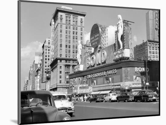 1950s New York City Times Square with Massive Bond Clothing Sign Between 44th and 45th Streets-null-Mounted Photographic Print