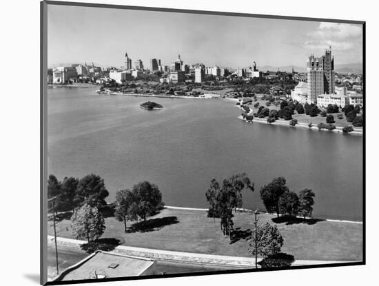 1950s with Lake Merritt in Foreground Skyline View of Oakland, California-null-Mounted Photographic Print