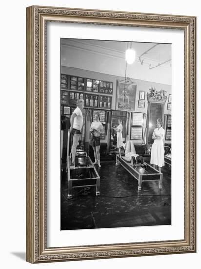 1951: Roberta Peters Working Out with Joseph Pilates and Others in a Studio, New York, NY-Michael Rougier-Framed Photographic Print