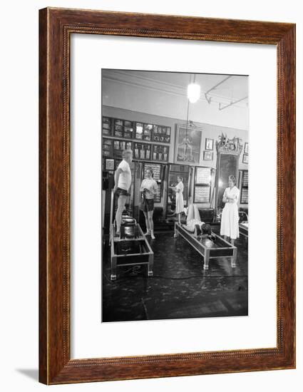 1951: Roberta Peters Working Out with Joseph Pilates and Others in a Studio, New York, NY-Michael Rougier-Framed Photographic Print