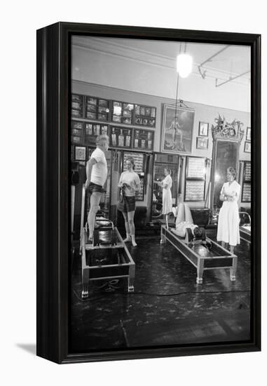 1951: Roberta Peters Working Out with Joseph Pilates and Others in a Studio, New York, NY-Michael Rougier-Framed Premier Image Canvas