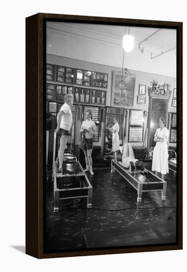 1951: Roberta Peters Working Out with Joseph Pilates and Others in a Studio, New York, NY-Michael Rougier-Framed Premier Image Canvas