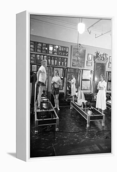 1951: Roberta Peters Working Out with Joseph Pilates and Others in a Studio, New York, NY-Michael Rougier-Framed Premier Image Canvas