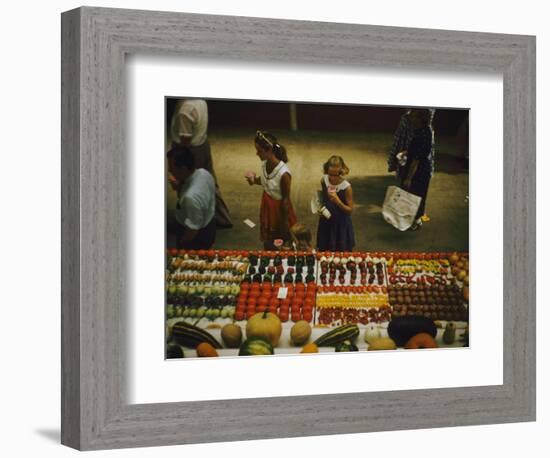 1955: Fairgoers as They Look at a Display of Produce at the Iowa State Fair, Des Moines, Iowa-John Dominis-Framed Photographic Print