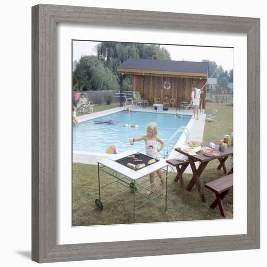 1959: Family Cookout and Enjoying the Backyard Swimming Pool, Trenton, New Jersey-Frank Scherschel-Framed Photographic Print