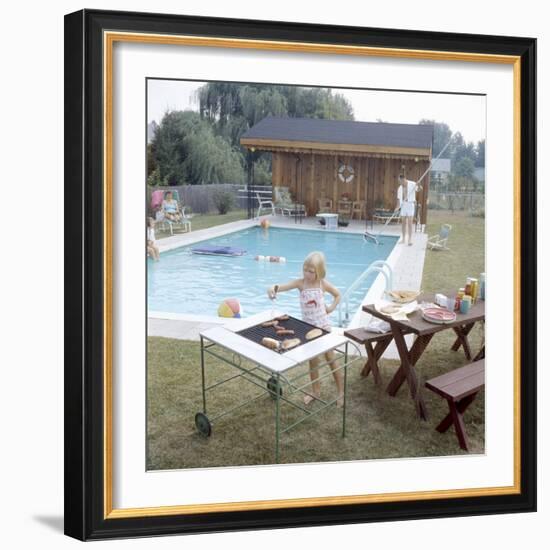 1959: Family Cookout and Enjoying the Backyard Swimming Pool, Trenton, New Jersey-Frank Scherschel-Framed Photographic Print