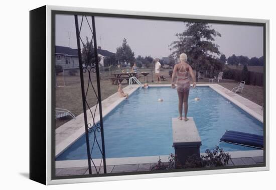 1959: Susan in Diving Stance During a Family Cookout, Trenton, New Jersey-Frank Scherschel-Framed Premier Image Canvas