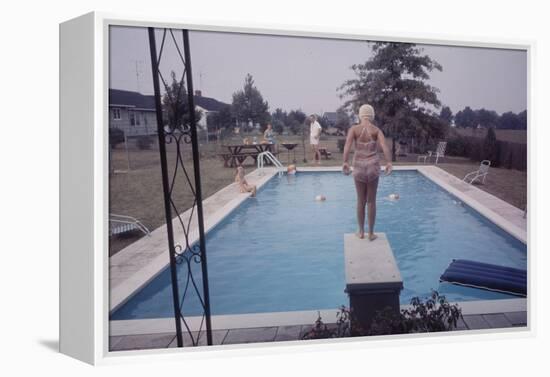 1959: Susan in Diving Stance During a Family Cookout, Trenton, New Jersey-Frank Scherschel-Framed Premier Image Canvas