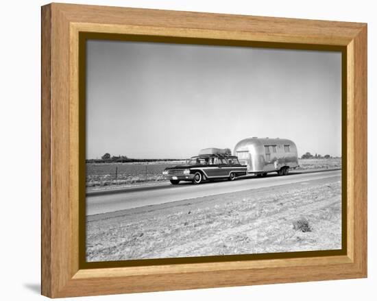 1960s-1970s Family Station Wagon and Camping Trailer Driving on Country Highway on Vacation-null-Framed Premier Image Canvas