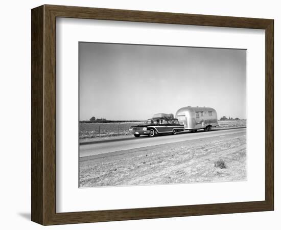 1960s-1970s Family Station Wagon and Camping Trailer Driving on Country Highway on Vacation-null-Framed Photographic Print