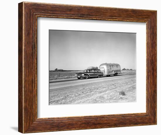 1960s-1970s Family Station Wagon and Camping Trailer Driving on Country Highway on Vacation-null-Framed Photographic Print