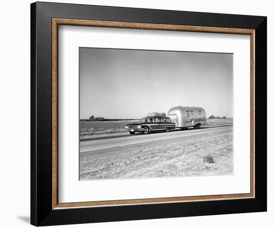 1960s-1970s Family Station Wagon and Camping Trailer Driving on Country Highway on Vacation-null-Framed Photographic Print